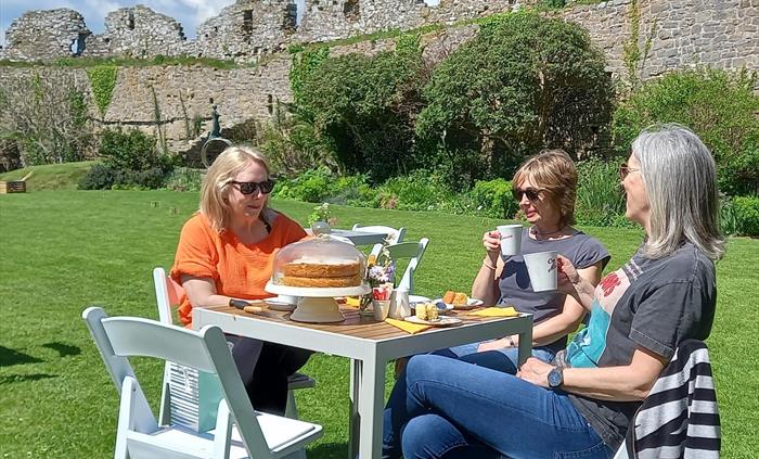 Visitors enjoying tea and homemade cake from the tearoom